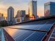 Solar Panel Photovoltaic installation on a Roof of factory, sunny blue sky background, alternative electricity source - Sustainable Resources Concept.